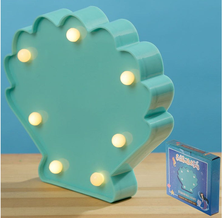 Luz led de concha marina encendida con caja / Nadie sin regalo
